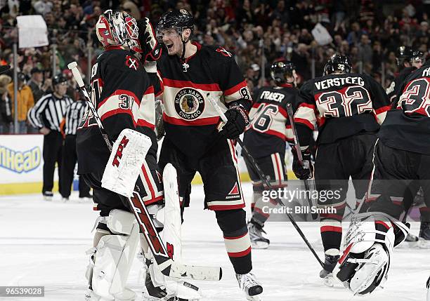 Tomas Kopecky of the Chicago Blackhawks thecelebrates with goalie Antti Niemi after winning in overtime against Dallas Stars on February 09, 2010 at...