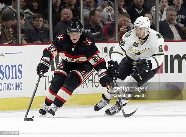 Marian Hossa of the Chicago Blackhawks takes control of the puck as Fabian Brunnstrom of the Dallas Stars approaches from behind on February 09, 2010...