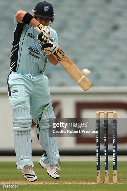 Phillip Hughes of the Blues plays a shot during the Ford Ranger Cup match between the Victorian Bushrangers and the New South Wales Blues at...