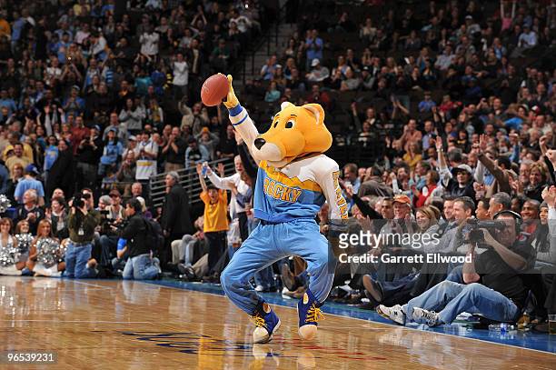 Denver Nuggets mascot Rock catches a ball from John Elway during the Denver Nuggets v the Dallas Mavericks on February 9, 2010 at the Pepsi Center in...