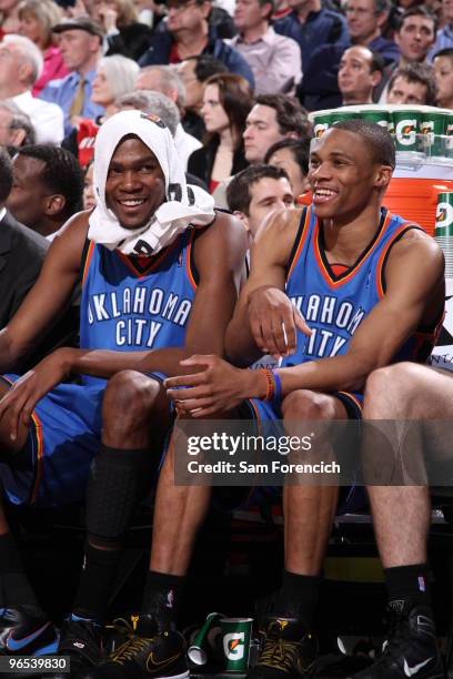 Kevin Durant and Russell Westbrook of the Oklahoma City Thunder laugh on the bench during a game against the Portland Trail Blazers on February 9,...