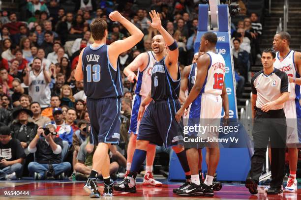 Mehmet Okur and Carlos Boozer of the Utah Jazz celebrate after a basket against the Los Angeles Clippers at Staples Center on February 9, 2010 in Los...