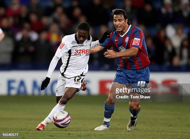 Nathan Dyer of Swansea tussles with Nick Carle of Palace during the Coca-Cola Championship match between Crystal Palace and Swansea City at selhurst...