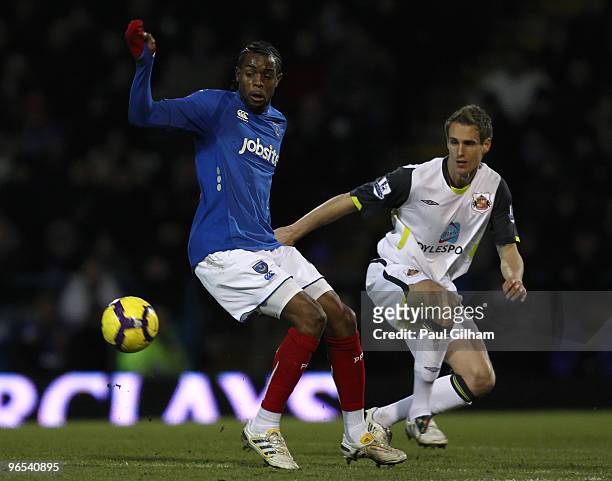 Frederic Piquionne of Portsmouth battles for the ball with Matthew Kilgallon of Sunderland during the Barclays Premier League match between...