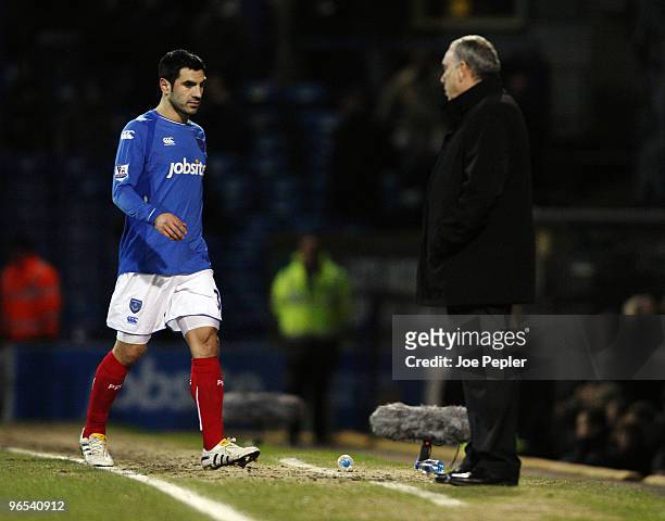 Ricardo Rocha of Portsmouth is sent off watched by Manager Avram Grant during the Barclays Premier League match between Portsmouth and Sunderland at...