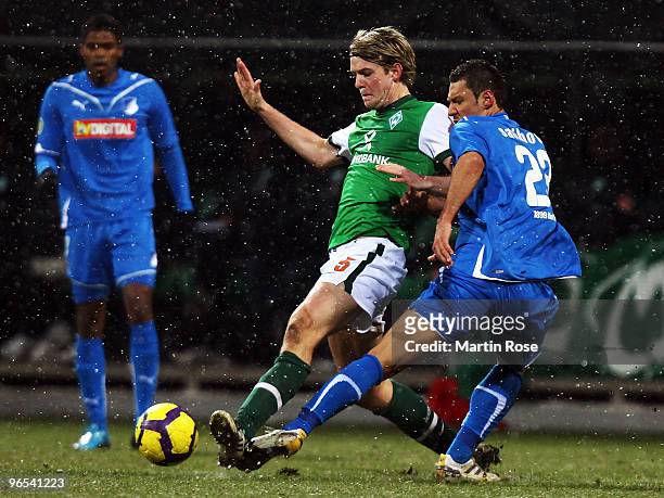 Peter Niemeyer of Bremen and Sejad Salihovic of Hoffenheim battle for the ball during the DFB Cup quarter final match between SV Werder Bremen and...