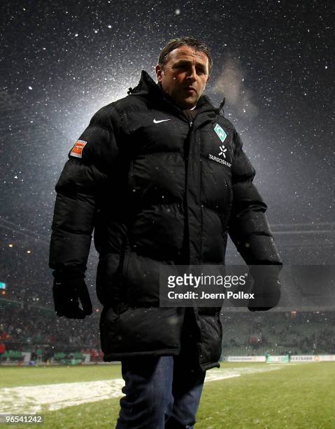 Manager Klaus Allofs of Bremen looks on prior to the DFB Cup quarter final match between SV Werder Bremen and 1899 Hoffenheim at Weser Stadium on...