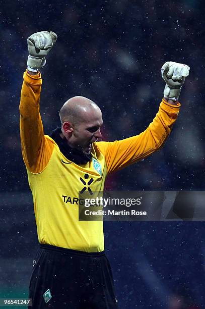 Christian Vander, goalkeeper of Bremen celebrates during the DFB Cup quarter final match between SV Werder Bremen and 1899 Hoffenheim at Weser...