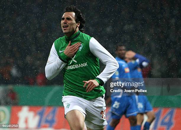 Hugo Almeida of Bremen celebrates after scoring his team's second goal during the DFB Cup quarter final match between SV Werder Bremen and 1899...