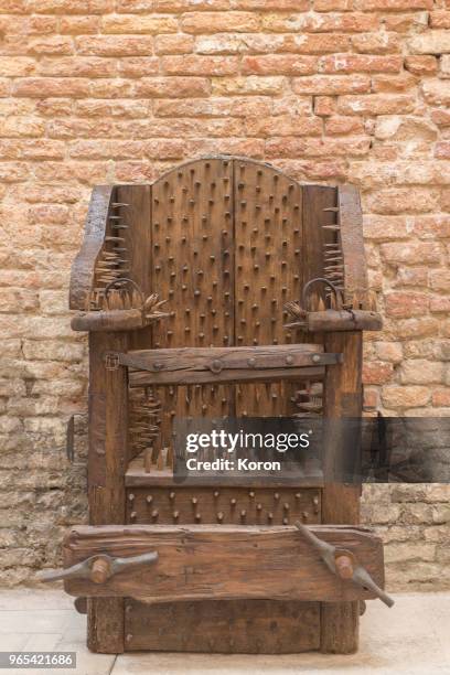 torture device - chair of torture - medieval torture stock pictures, royalty-free photos & images