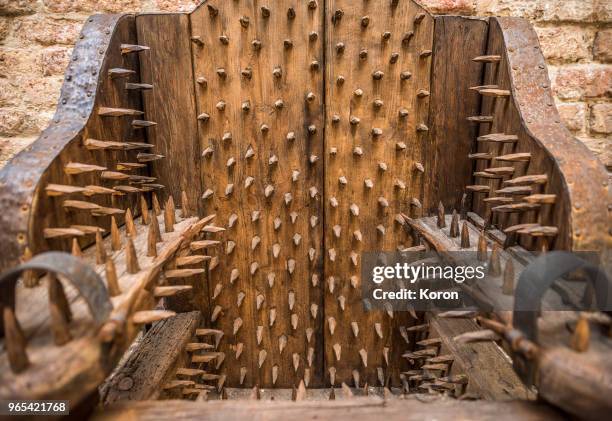 torture device - chair of torture - medieval punishment stock pictures, royalty-free photos & images