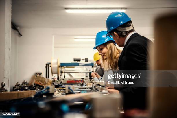factory - headwear stock pictures, royalty-free photos & images