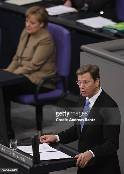 German Vice Chancellor and Foreign Minister Guido Westerwelle delivers his speech during a session at the German Parliament at the Reichstag building...