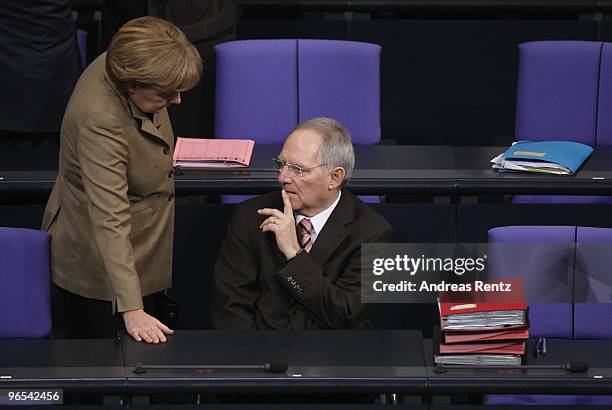 German Chancellor Angela Merkel chats with German Finance Minister Wolfgang Schaeuble prior to a session at the German Parliament at the Reichstag...