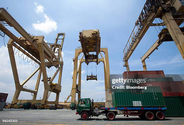 Truck driver waits at a shipping container port to unload his cargo, in Jakarta, Indonesia, on Wednesday, Feb. 10, 2010. Indonesia's economy grew at...