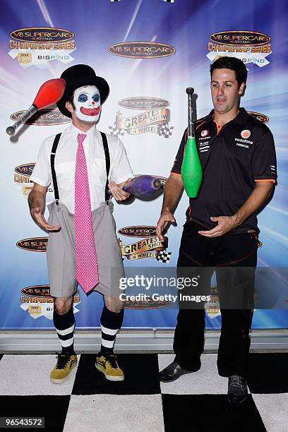 Supercar driver Jamie Whincup juggles with performer during the V8 Supercars 2010 Season Launch at Fox Studios on February 10, 2010 in Sydney,...