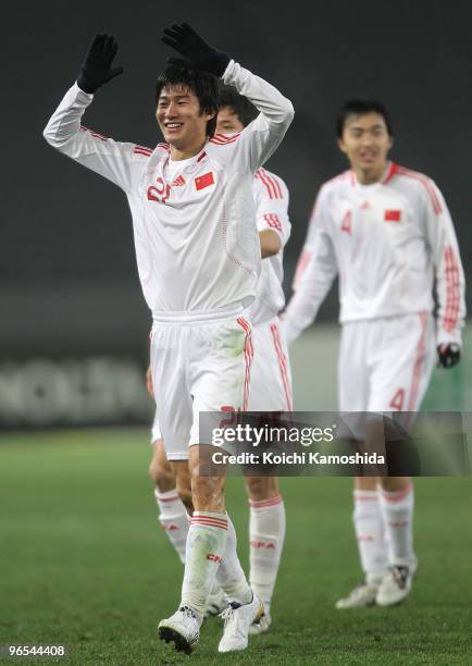 Hai Yu of China celebrates his goal with teammate Bo Qu during the East Asian Football Championship 2010 match between China and South Korea at...