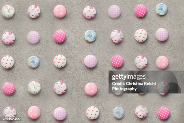 different colorful buttons on a table - button craft foto e immagini stock