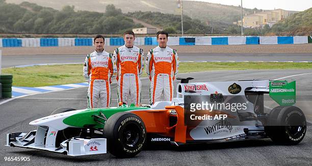 Force India's German driver Adrian Sutil , Italian Vitantonio Liuzzi and British Paul di Resta pose with the new VJM03 Formula 1 car during the...