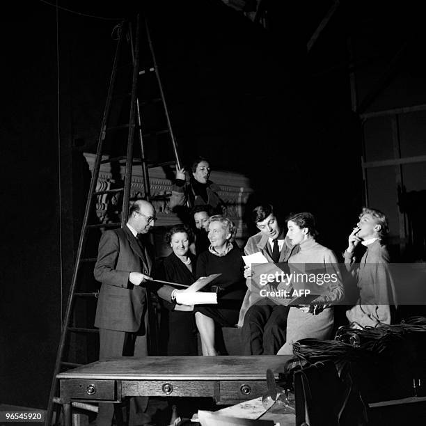 French aristocrat and fashion designer Hubert de Givenchy prepares the 1952 spring/summer collection with his team on February 2, 1952 in Paris. AFP...