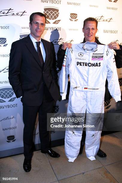Michael Schumacher and Philippe Gaydoul, CEO of Gaydoul Group pose during a press conference at P1 discotheque on February 10, 2010 in Munich,...