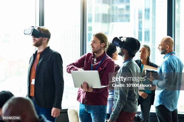 people using technology in office - virtual reality simulator stock-fotos und bilder
