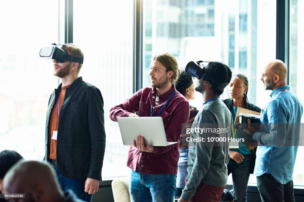 People using technology in office
