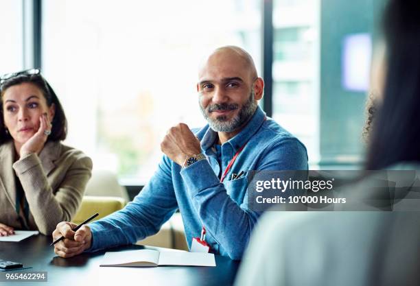 people having meeting in office - business satisfaction stock pictures, royalty-free photos & images