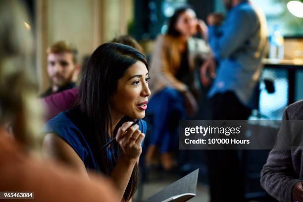 people having meeting in office - american indian woman stock pictures, royalty-free photos & images