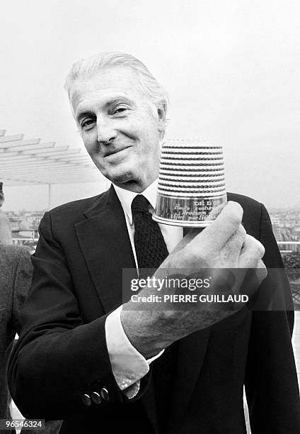 French aristocrat and fashion designer Hubert de Givenchy poses with the golden thimble of the French Fashion on January 28, 1982 in Paris. Reserved...