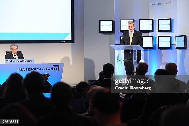 Philippe Varin, chief executive officer of PSA Peugeot Citroen, right, speaks as Frederic Saint Geours, chief financial officer of PSA Peugeot...