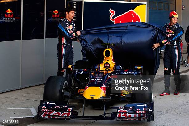 Red Bull Racing drivers Mark Webber of Australia and Sebastian Vettel of Germany unveil the new RB6 during winter testing at the at the Circuito De...
