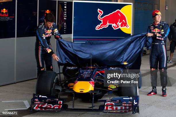 Red Bull Racing drivers Mark Webber of Australia and Sebastian Vettel of Germany unveil the new RB6 during winter testing at the at the Circuito De...