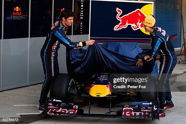 Red Bull Racing drivers Mark Webber of Australia and Sebastian Vettel of Germany unveil the new RB6 during winter testing at the at the Circuito De...