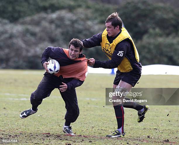 Danny Care of England moves past under 20 flanker Will Welch during the England training session held at Pennyhill Park on February 10, 2010 in...