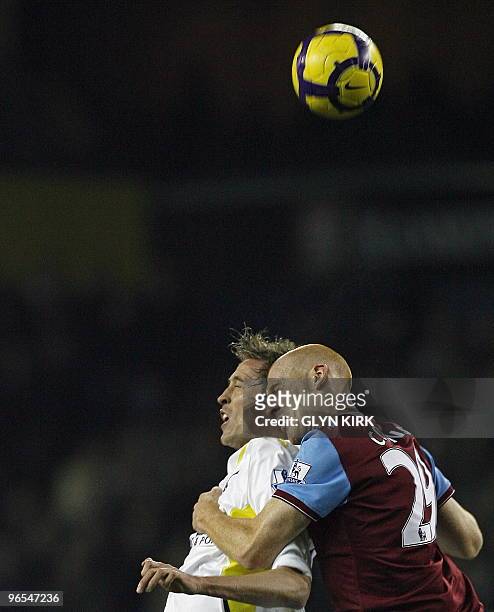 Tottenham Hotspur's English striker Peter Crouch vies with Aston Villa's Welsh defender James Collins during the English Premier League football...