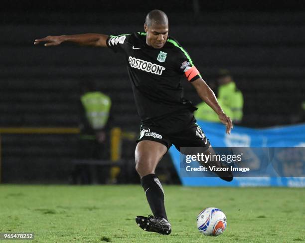 Alexis Henriquez of Nacional kicks the ball during semifinal first leg match between Atletico Huila and Atletico Nacional as part of Liga Aguila 2018...