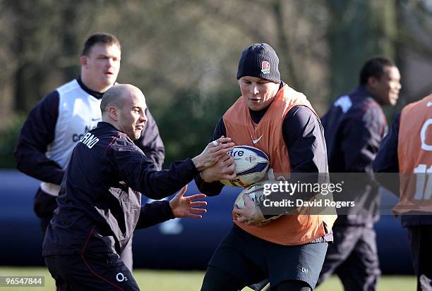 Dylan Hartley moves past Paul Hodgson during the England training session held at Pennyhill Park on February 10, 2010 in Bagshot, England.