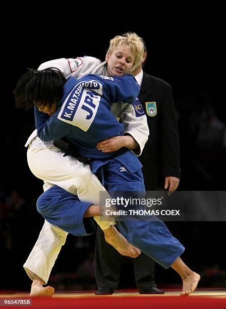 Japan's Kaori Matsumoto competes with France's Morgane Ribout during their women final round fight in the under 66kg category as part of the Paris...