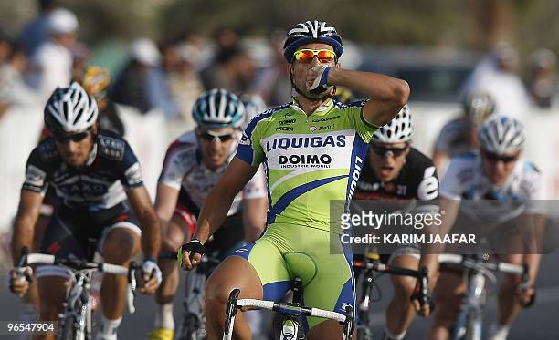 Liquigas team rider Francesco Chicchi of Italy celebrates after crossing the finish line to win the fourth stage of the Tour of Qatar cycling race...