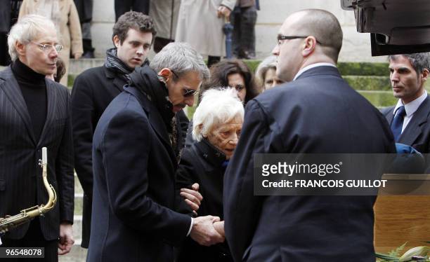 French actor Lambert Wilson and Jean-Marie Wilson leave the Saint-Roch church following the funeral ceremony for their father, French actor and...