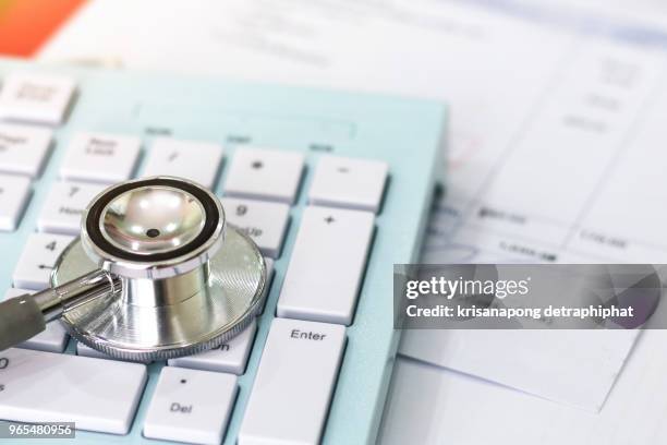 cost of health care. concept,stethoscope and prescriptions - medicaid stockfoto's en -beelden