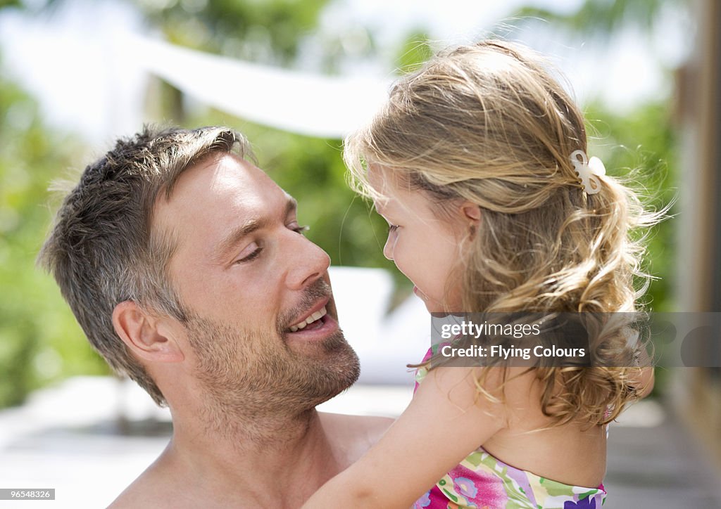 Man holding daughter