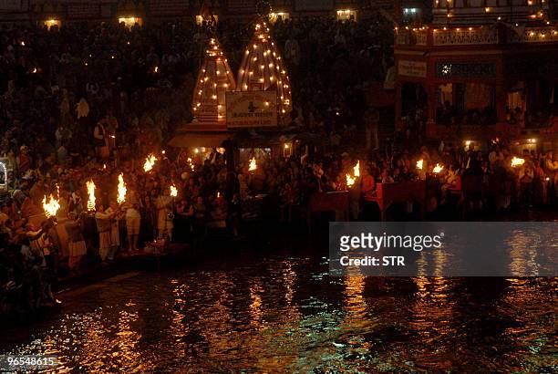 Thousands of devotees from across the globe participate in the evening 'aarti' or prayer of the Mighty Ganga with oil lamps at Har Ki Pauri on the...