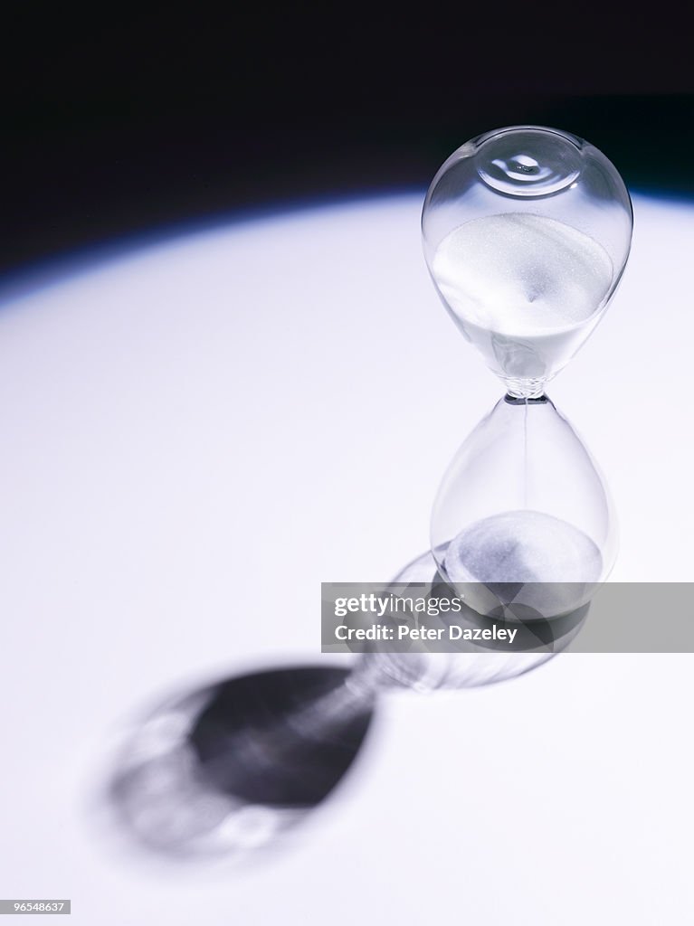 Hour glass on white background