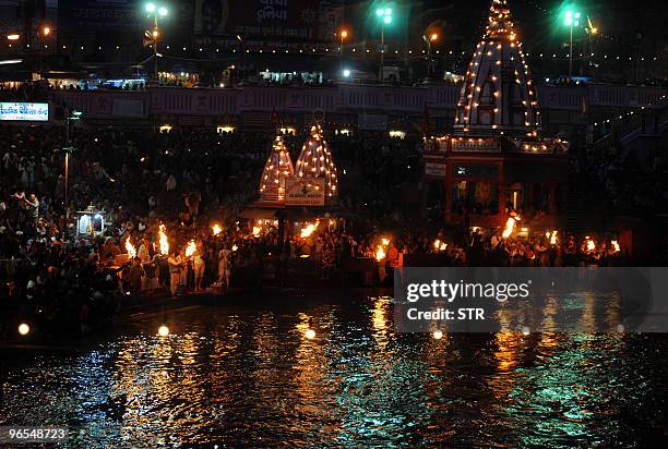 Thousands of devotees from across the globe participate in the evening 'aarti' or prayer of the Mighty Ganga with oil lamps at Har Ki Pauri prior to...