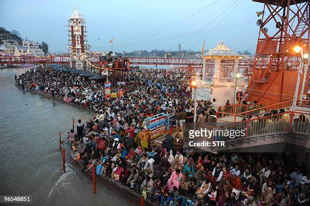 Thousands of devotees from across the globe assemble for the evening 'aarti' or prayer of the Mighty Ganga with oil lamps at Har Ki Pauri prior to...