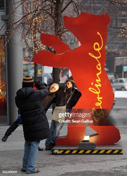 Members of the cast of the Italian film "Due Vite per Caso", which will premiere in the Berlinale Panorama selection, snap pictures of each other in...