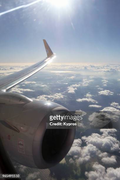 asia, turkey, istanbul area, 2018: aerial view of clouds through window of jet aircraft flying over turkey - commercieel vliegtuig deur stockfoto's en -beelden