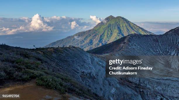 people hiking on kawah ijen, java, indonesia - sulfuric acid stock pictures, royalty-free photos & images